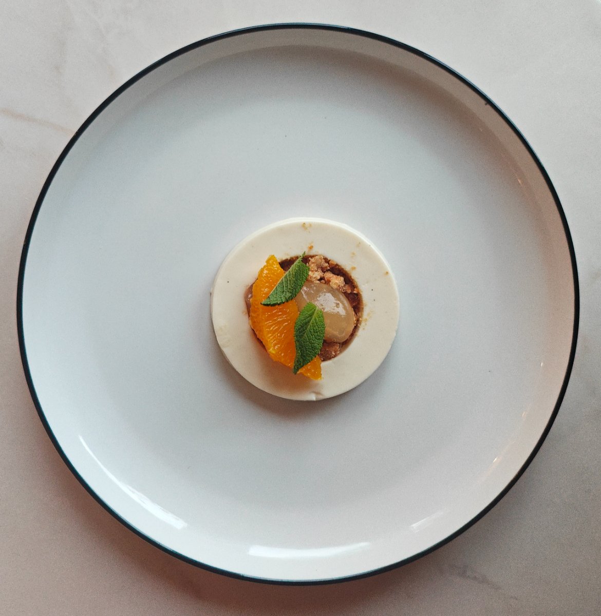 Panna cotta met sinaasappel en munt